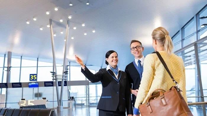 Airport Management staff helping a traveler