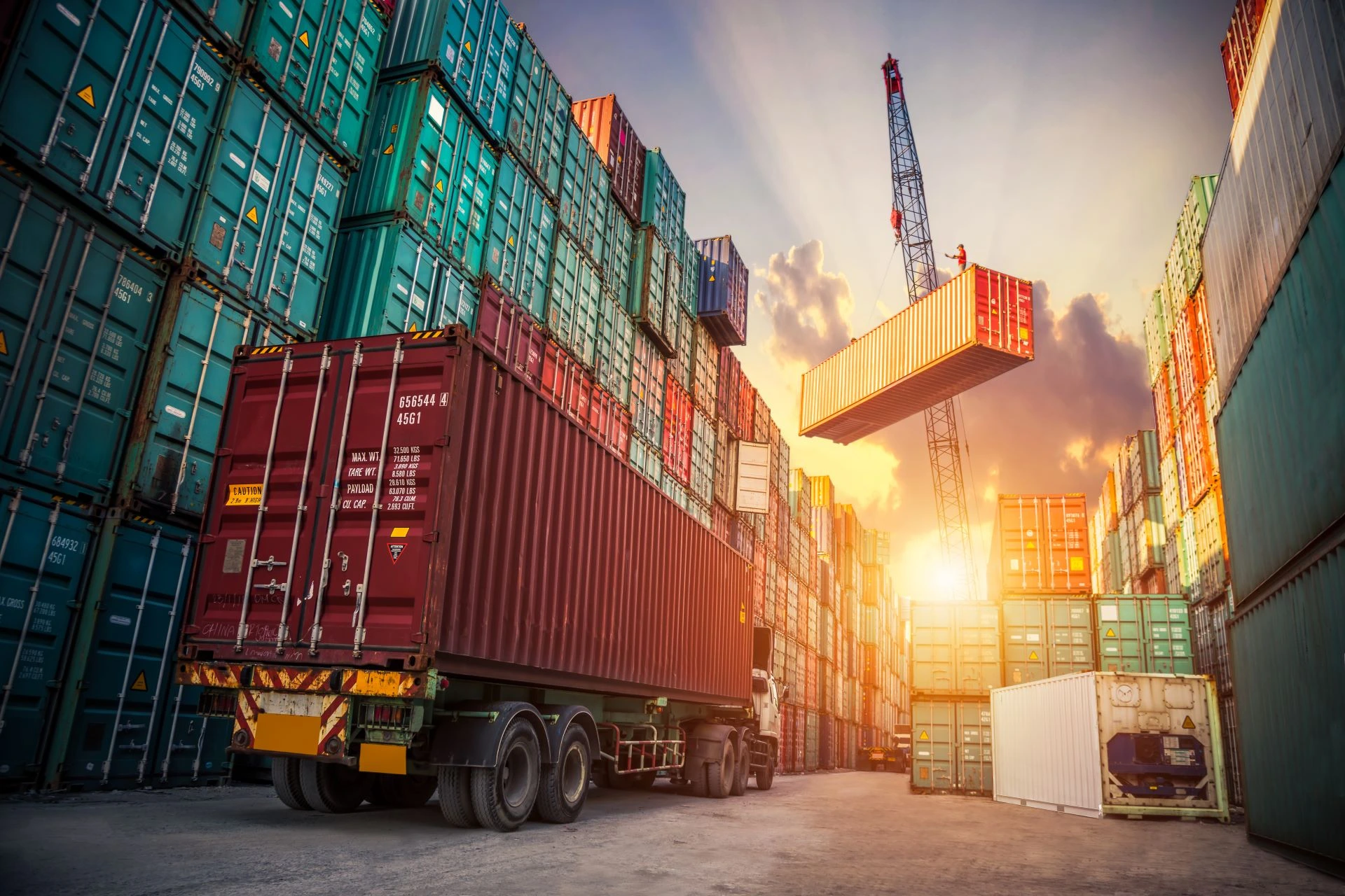 A shipping port with truck and containers